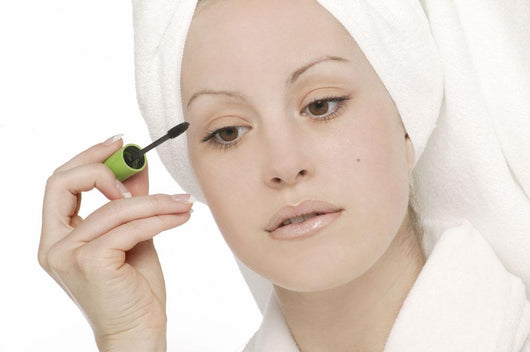Woman Applying Mascara Wall Mural