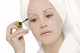 Woman Applying Mascara Wall Mural