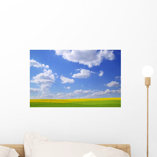 Scenic View Of Meadow And Canola Crop Wall Mural