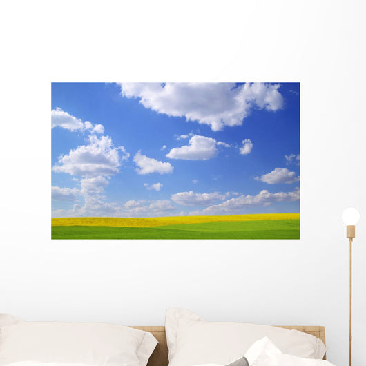 Scenic View Of Meadow And Canola Crop Wall Mural