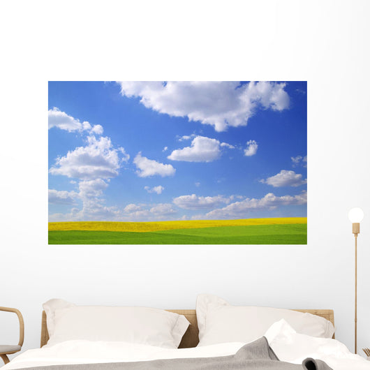 Scenic View Of Meadow And Canola Crop Wall Mural