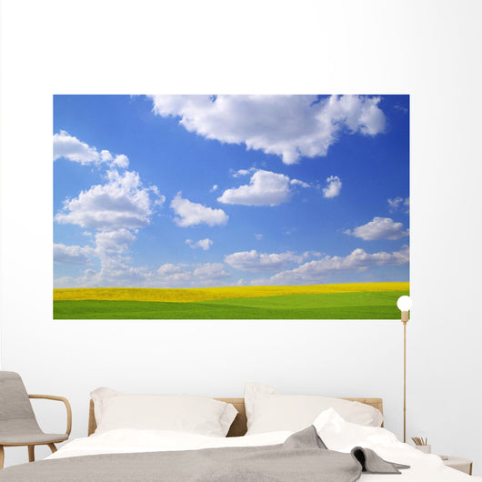 Scenic View Of Meadow And Canola Crop Wall Mural