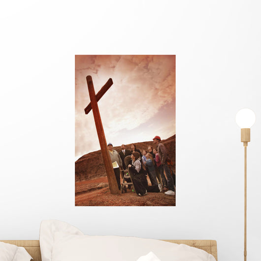 A Small Crowd Gathered At A Wooden Cross Wall Mural