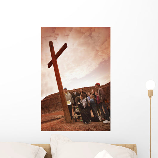 A Small Crowd Gathered At A Wooden Cross Wall Mural