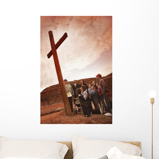 A Small Crowd Gathered At A Wooden Cross Wall Mural
