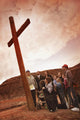 A Small Crowd Gathered At A Wooden Cross Wall Mural