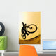 Silhouette Of A Cyclist Against A Yellow Sky Wall Mural