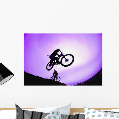 Stunt Cyclist Silhouette Wall Mural shown on a wall