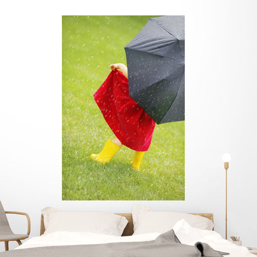 A Little Girl Walking In The Rain While Holding An Umbrella Wall Mural