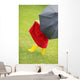 A Little Girl Walking In The Rain While Holding An Umbrella Wall Mural