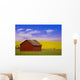 A Red Farm Building Against A Canola Field Wall Mural