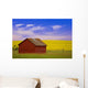 A Red Farm Building Against A Canola Field Wall Mural