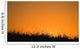 A Grassy Field With The Sun Setting Behind It Wall Mural