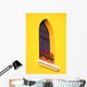 A Window In A Bright Yellow Wall Wall Mural