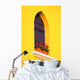 A Window In A Bright Yellow Wall Wall Mural