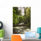 A Rushing River In A Forest Wall Mural