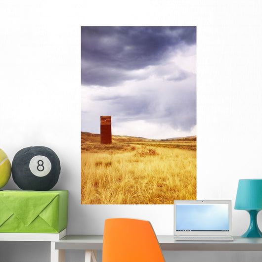 A Grain Elevator In A Field Wall Mural