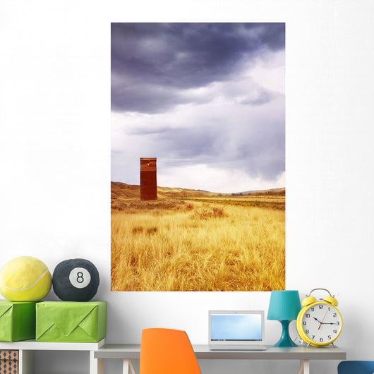 A Grain Elevator In A Field Wall Mural