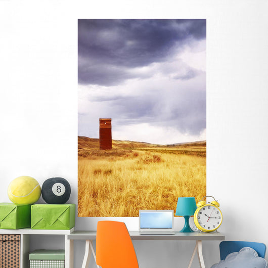 A Grain Elevator In A Field Wall Mural