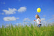 Child Running With A Balloon Wall Mural