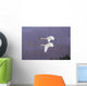 Whooper Swans Flying In Falling Snow Wall Mural