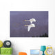Whooper Swans Flying In Falling Snow Wall Mural