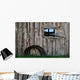 Roll Of Barbed Wire On Weathered Barn Wall Mural