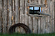 Roll Of Barbed Wire On Weathered Barn Wall Mural