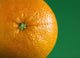 Orange Fruit On Green Background Wall Mural