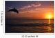 Silhouette Of Bottlenose Dolphin Leaping Over Ocean At Sunset Wall Mural