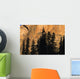 Tree Silhouettes In Front Of Cliff Face Wall Mural
