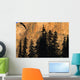 Tree Silhouettes In Front Of Cliff Face Wall Mural