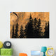Tree Silhouettes In Front Of Cliff Face Wall Mural