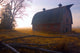 A Barn Sits In Morning Mist Wall Mural