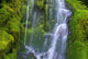 Waterfall Over Moss-Covered Rocks Wall Mural