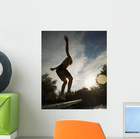 Boy Jumping Off Diving Board Wall Mural