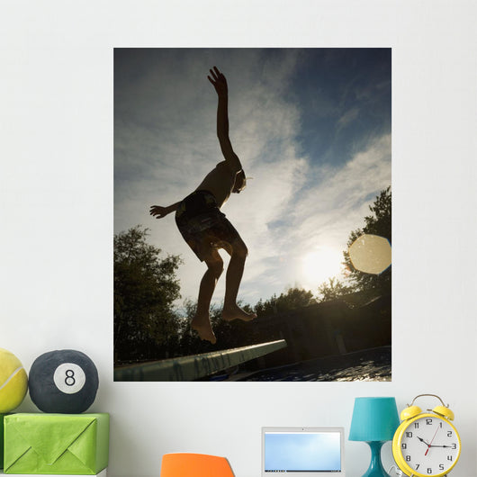 Boy Jumping Off Diving Board Wall Mural