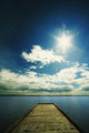 Bright Sun Over Dock On Lake Wall Mural