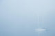 Sailboat In A Fog Wall Mural