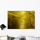 Centered mysterious road in autumn forest. Wall Mural