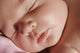 Closeup Of Sleeping Baby's Face Wall Mural