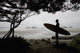 Silhouette Of A Surfer Looking Out To The Water From The Beach Wall Mural