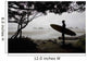 Silhouette Of A Surfer Looking Out To The Water From The Beach Wall Mural