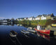 Boats Moored At A Harbor Wall Mural