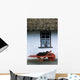 Wheelbarrow In Front Of A Window Of A Cottage Wall Mural