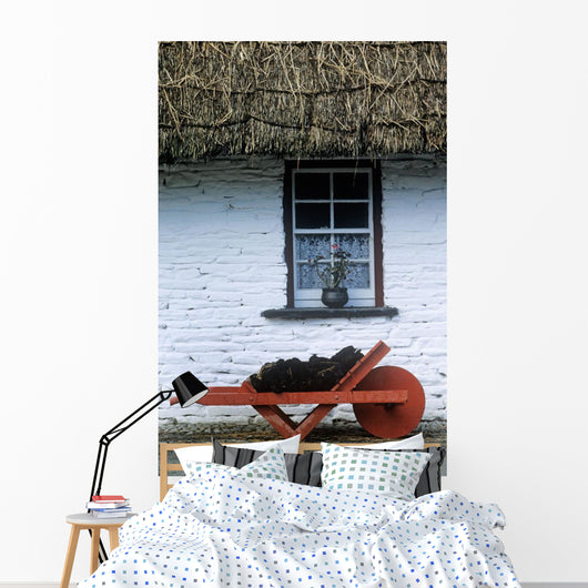 Wheelbarrow In Front Of A Window Of A Cottage Wall Mural