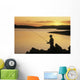 Silhouette Of A Fisherman Fishing On The Coast Wall Mural