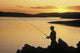 Silhouette Of A Fisherman Fishing On The Coast Wall Mural