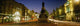 Statue Of A Man On A Pedestal On The Street At Dusk Wall Mural