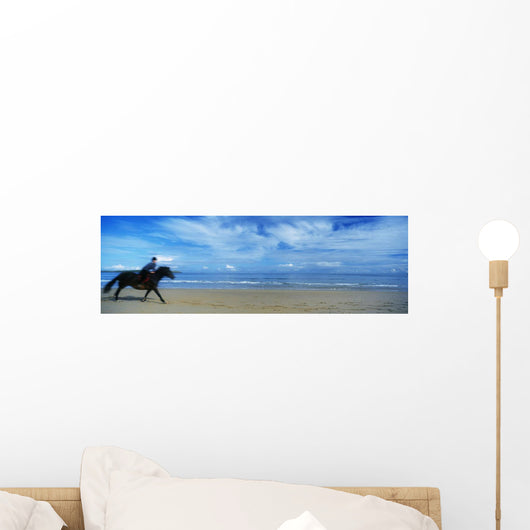 Man Riding A Pony On The Beach Wall Mural